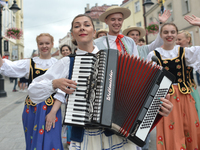 Members of 'Karolinka' Polish Dance Group from Brzesc, Belarussia, during the traditional parade walk through the renovated 3rd May Street o...