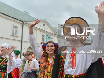Members of a Polish dance group from Russia, during the traditional parade walk through the renovated 3rd May Street on the opening day of t...