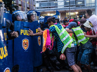 Protesters from Southern Tagalog clash with the police as they attempt to storm the US Embassy. Groups from Southern Tagalog hold a demonstr...