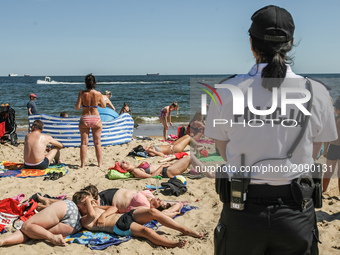 Police officers are seen on the Baltic Sea beach in Gdansk, Poland on 22 July 2017 Gdansk Pomeranian County Police Command plans to create t...