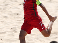 Brazil's defender Bruno Xavier celebrates after scoring a goal during the Beach Soccer Mundialito 2017 match between Portugal and Brazil at...