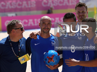 France's defender Fischer (2nd L) is awarded by his last game for the National team during the Beach Soccer Mundialito 2017 match between Ru...