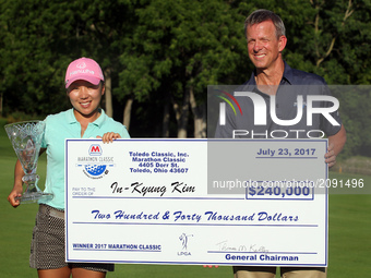 I.K. Kim of Korea holds the check and trophy after winning the tournament during the final round of the Marathon LPGA Classic golf tournamen...