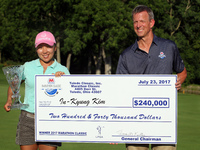 I.K. Kim of Korea holds the check and trophy after winning the tournament during the final round of the Marathon LPGA Classic golf tournamen...