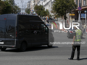 A policeman controls traffic at a Khreshchatyk street in Kyiv, Ukraine   (