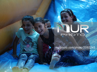Palestinian children enjoy as part of the activities proposed during a Summer Fun Weeks 2017 organised by the United Nations, in Jabalia ref...