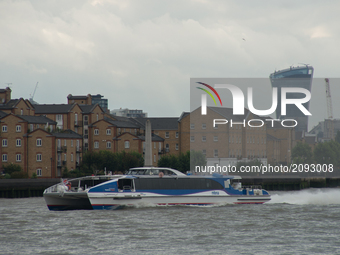A river boat clipper is pictured on river Thames against the backdrop of the City, London on July 24, 2017. The skyline is always changing a...