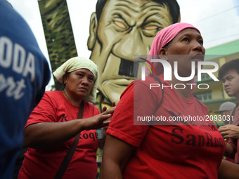 Protesters near the House of Representatives during President Rodrigo Duterte’s 2nd State of the Nation Address (SONA) in Quezon City, north...
