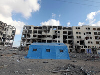Damaged residential buildings as they return to Beit Lahiya town, in Gaza, on August 9, 2014 which witnesses said was heavily hit by Israeli...
