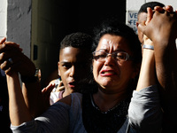 Relatives of the prisoners await news during a rebellion with fire on mattresses at the Provisional Detention Center of Pinheiros, in the We...