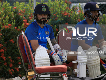 Indian cricket captain Virat Kohli(L) takes part in a practice session ahead of the 1st test match between Sri Lanka and India at Galle Inte...
