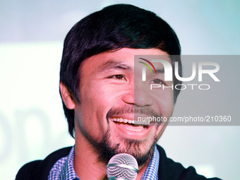 Makati, Philippines - Manny Pacquiao smiles while answering questions from the media during a promotional event held in Makati on August 12,...