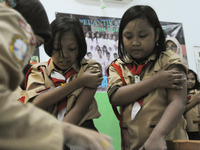 BUKIT DURI, JAKARTA, INDONESIA, AUGUST - 02 : Health officers gave Measleas Rubela (MR) immunization injection to elementary school students...