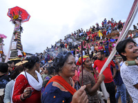 Nepalese devotees hold stick fragrant as they take part in a procession during Gai Jatra or Cow Festival celebrated in Bhaktapur, Nepal on T...
