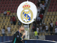 Real Madrid's Spanish defender Sergio Ramos kiss his trophy after winning the UEFA Super Cup football match between Real Madrid and Manchest...