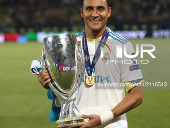 Real Madrid's Costa Rican goalkeeper Keylor Navas poses for a picture with his trophy after winning the UEFA Super Cup football match betwee...