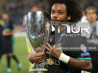 Real Madrid's Spanish defender Marcelo poses for a picture with his trophy after winning the UEFA Super Cup football match between Real Madr...