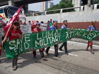 Indigenous and non-indigenous activists hold a rally coinciding the International Day of the World's Indigenous Peoples outside Camp Aguinal...