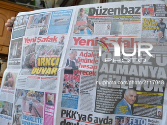 A woman holds a today's copy of Turkish pro-government daily newspaper Yeni Safak in Ankara, Turkey on August 09, 2017. The daily claims on...