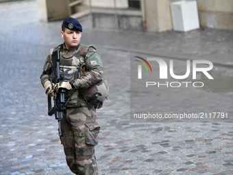 An armed French soldier patrols in Levallois-Perret, outside Paris, on August 9, 2017. French police launched a manhunt on August 9 after a...