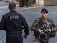 Armed French soldiers patrols in Levallois-Perret, outside Paris, on August 9, 2017. French police launched a manhunt on August 9 after a ca...