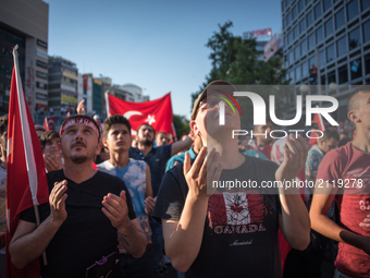 Pro-government demonstrators pray in central Ankara, Turkey, the day after the failed coup attempt on 16 July 2016. (