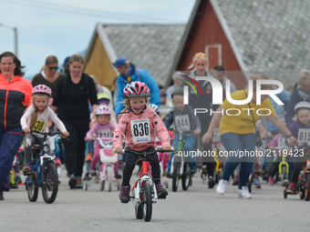 A group of local children from Andorja Island compete during a 500m race on the opening day of Arctic Race of Norway 2017. 
On Thursday, Aug...
