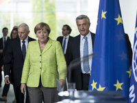 German Chancellor Angela Merkel (L) and High Commissioner of United Nations High Commissioner for Refugees (UNHCR) Filippo Grandi (R) arrive...