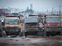 Dust from local mining operations pollutes the air and covers trucks in La Negra, Chile. Photo taken 11 June 2012. (