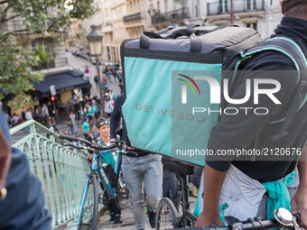 Bike delivery people from the Deliveroo food delivery service demonstrate on August 11, 2017 at Place de la Republique in Paris, France to d...