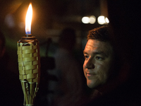 Young men hold up torches during Neo Nazis, Alt-Right, and White Supremacists rally a the night before the 'Unite the Right' rally in Charlo...
