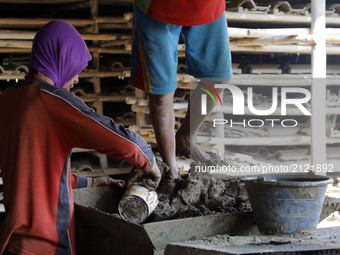  Craftsmen produce tile in Brujul Wetan Village, Majalengka, West Java, on August, 12,2017. When the dry season in a month this traditional...