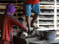  Craftsmen produce tile in Brujul Wetan Village, Majalengka, West Java, on August, 12,2017. When the dry season in a month this traditional...