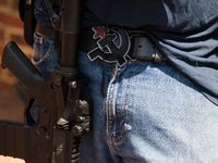 A member of a leftist pro-gun group called Redneck Revolt openly carries his firearm in Charlottesville, VA on Saturday August 12th.  (
