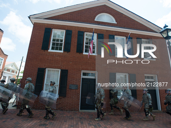 The Virginia National Guard block a street as protesters march in Charlottesville, Virginia on August 12, 2017. A picturesque Virginia city...