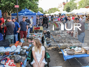 People looking for goods at a flea market during 757th edition of St. Dominic’s Fair are seen in Gdansk, Poland on 13 August 2017  More than...