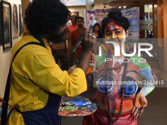 Indian Models participate at The Live Body Painting Art show organized by Creative Dream in Kolkata, India on 13 August 2017. Body painting,...