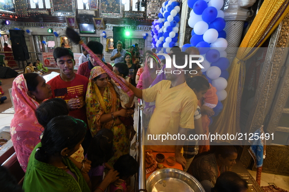 Hindu devotees celebrate the Maha Jarmastami at a city temple on August 14,2017 in Kolkata,India. 