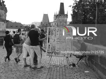 Tourists on the Charles Bridge is the oldest bridge in Prague, and crosses the Vltava River from the Old Town to the Small Town was built in...