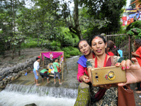 Nepalese people takes selfie during Krishna Janmashtami Festival celebrated at ISKON Nepal, Budhanilkantha, Kathmandu, Nepal on Monday, Augu...