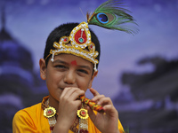A Kid impersonate as Lord Krishna during Krishna Janmashtami Festival celebrated at ISKON Nepal, Budhanilkantha, Kathmandu, Nepal on Monday,...