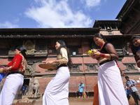 Nepalese Hindu devotees lining celebrate Krishna Janmashtami by offering ritual prayers at Krishna temple in Patan, Nepal on Monday, August...
