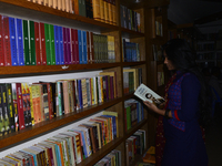 A Bangladeshi People reads and search Novel, Historical, Literature and others books for buy in a bookshop in Dhaka, Bangladesh, on August 1...