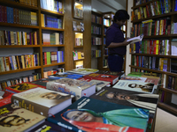 A Bangladeshi People reads and search Novel, Historical, Literature and others books for buy in a bookshop in Dhaka, Bangladesh, on August 1...