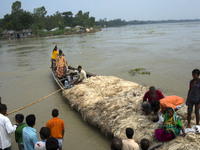 People comes from other place when all area under the floodwater at Sariakandhi, Bogra, Bangladesh 15 August 2017. Flood-related incidents i...