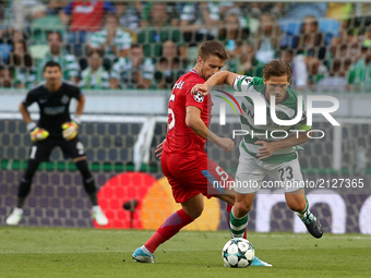 Sporting's midfielder Adrien Silva from Portugal (R ) vies with Steaua's midfielder Mihai Pintilii during the UEFA Champions League play-off...