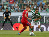 Sporting's midfielder Adrien Silva from Portugal (R ) vies with Steaua's midfielder Mihai Pintilii during the UEFA Champions League play-off...