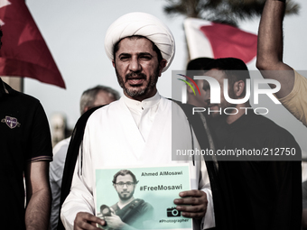 Bahrain , Duraz - Secertary-General of AlWefaq Political society Sh. Ali Salman taking a part during a sit in with detainee photographers an...