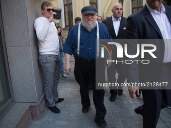 American novelist and short-story writer, screenwriter, and television producer George R. R. Martin leaves after a press conference  on Augu...