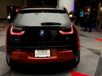 NEW YORK - April 17, 2014. A member of the press takes photos of the BMW i3 at the World Car Awards in the New York International Auto Show...